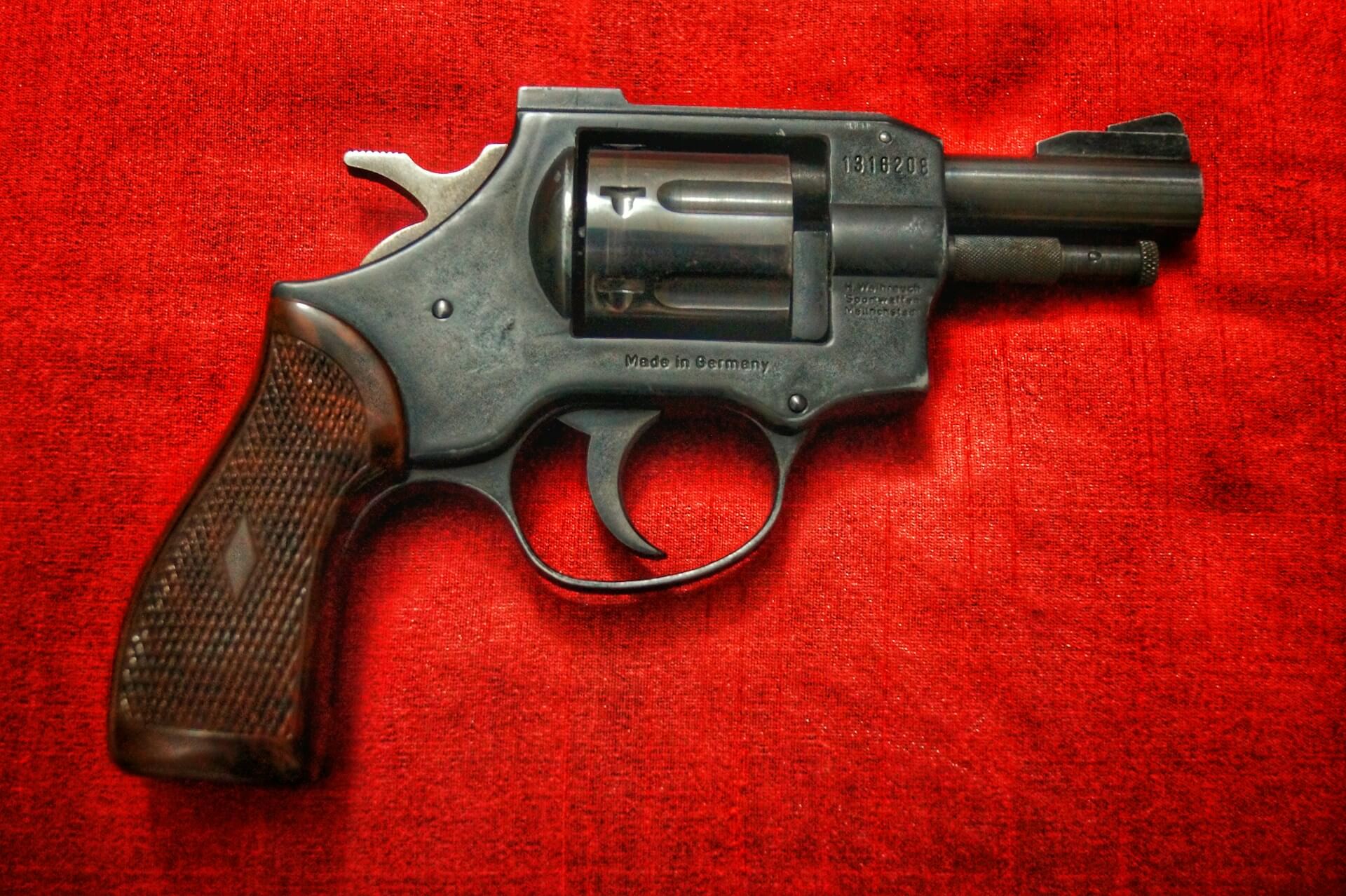 Revolver against a red background