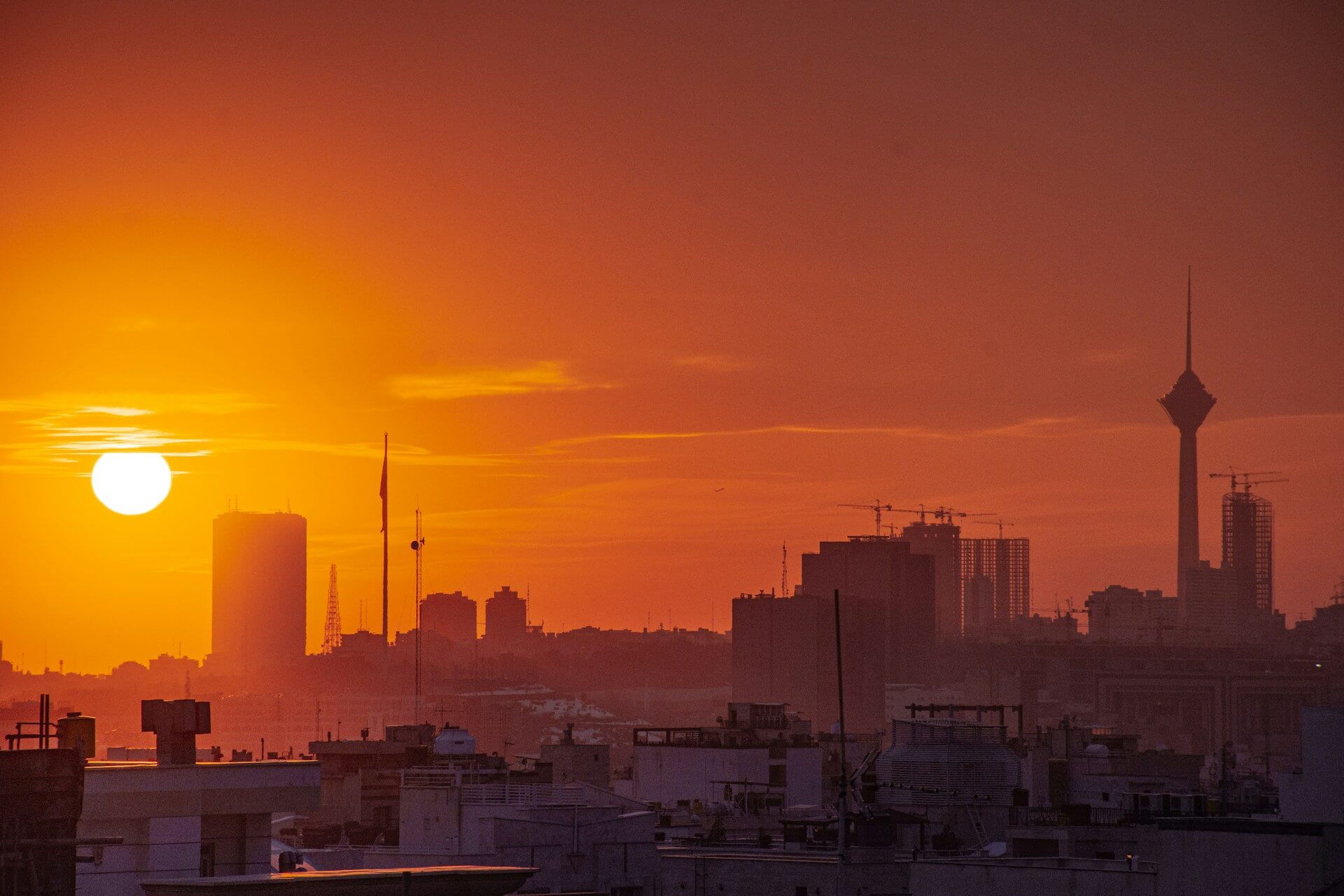Tehran skyline during an orange sunset