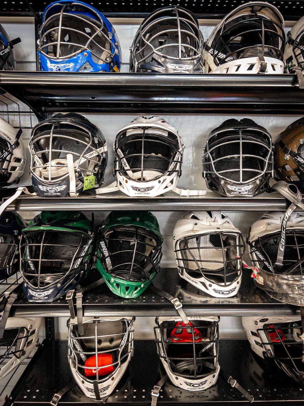 lacrosse helmets lying on the shelves